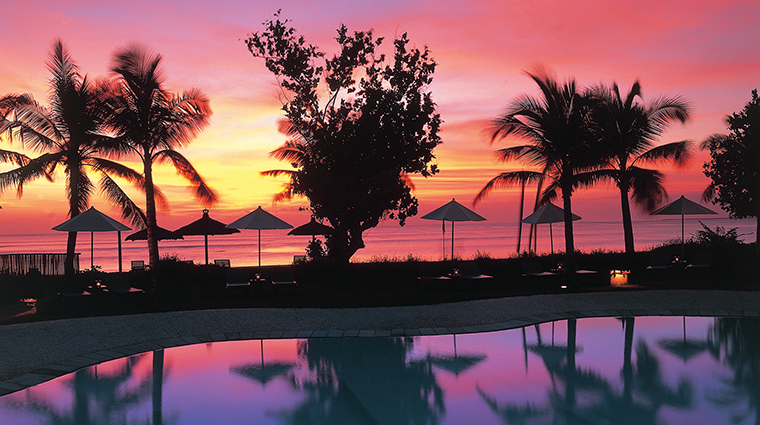 belmond jimbaran puri pool sunset